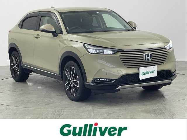ホンダ ヴェゼル ハイブリッド e:HEV Z 愛知県 2023(令5)年 1.7万km サンドカーキパール 純正9インチディスプレイオーディオ/（BT/AM/FM/フルセグTV）/全方位バックカメラ/ハーフレザーシート/前席シートヒーター/置くだけ充電/電動リアゲート/HondaSENSING/・アダクティブクルーズコントロール/・衝突軽減ブレーキ/・ブラインドスポッとモニター/・レーンキープアシスト/スポーツモード/エコノミーモード/純正18インチAW/純正フロアマット/ドアバイザー/純正フロアマット/トノカバー/純正18インチAW