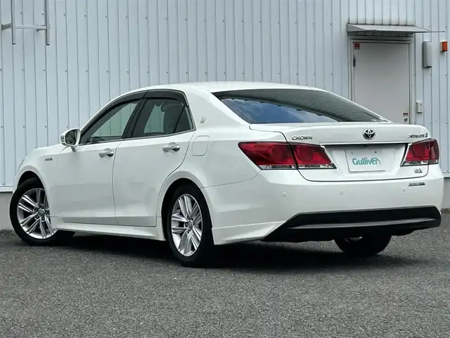 トヨタ クラウン ハイブリッド アスリートS 熊本県 2013(平25)年 4.8万km ホワイトパールクリスタルシャイン 純正ナビ/・フルセグTV/BT/DVD/AM/FM/バックカメラ/インテリジェントクリアランスソナー/プリクラッシュセーフティ機能/横滑り防止装置/車両接近警告機能/レーンキープアシスト/ACC/パワーシート/・シートヒーター/革巻きステアリング/・ステアリングスイッチ/・ステアリングヒーター/オートライト/・フォグランプ/電動格納ミラー/・ウィンカーミラー/純正ドアバイザー/純正AW/ドライブレコーダー/ビルトインETC/リアサンシェード