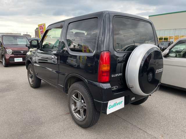 スズキ ジムニー クロスアドベンチャー 石川県 2013(平25)年 5.5万km 黒 社外ナビ　ワンセグＴＶ　キーレス　４ＷＤ　ターボ　電動ミラー　純正アルミホイール　スタッドレス＆ＡＷ積み込み