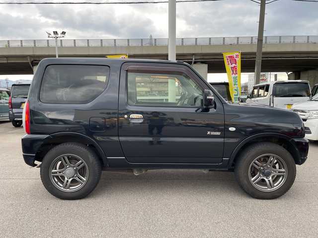 スズキ ジムニー クロスアドベンチャー 石川県 2013(平25)年 5.5万km 黒 社外ナビ　ワンセグＴＶ　キーレス　４ＷＤ　ターボ　電動ミラー　純正アルミホイール　スタッドレス＆ＡＷ積み込み