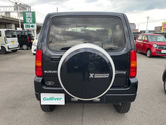 スズキ ジムニー クロスアドベンチャー 石川県 2013(平25)年 5.5万km 黒 社外ナビ　ワンセグＴＶ　キーレス　４ＷＤ　ターボ　電動ミラー　純正アルミホイール　スタッドレス＆ＡＷ積み込み