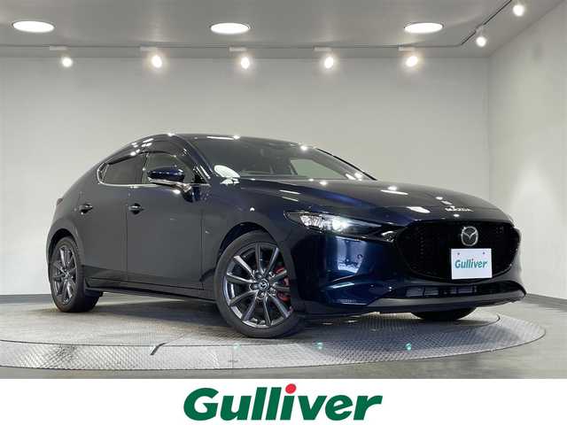 マツダ マツダ３ファストバック 15S ツーリング 愛知県 2020(令2)年 1.5万km ディープクリスタルブルーマイカ 純正８．８インチナビ/衝突軽減ブレーキ/レーダークルーズコントロール/レーンキープアシスト/ブラインドスポットモニター/コーナーセンサー/ヘッドアップディスプレイ/前後ドライブレコーダー/ＥＴＣ/ＬＥＤヘッドライト/柿本マフラー/アイドリングストップ/ISOFIX