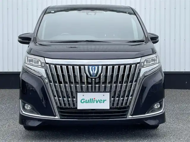 トヨタ エスクァイア ハイブリッド Gi プレミアムパッケージ 千葉県 2019(平31)年 4.8万km スパークリングブラックパールクリスタルシャイン 純正10インチナビ/(フルセグTV/BT/CD/DVD/FM/AM)/バックカメラ/衝突被害軽減システム/車線逸脱警報/クルーズコントロール/ハーフレザーシート/両側パワースライドドア/横滑り防止装置/ビルトインETC/アイドリングストップ/LEDヘッドライト/フォグランプ/オートライト/ウィンカーミラー/電動格納ミラー/純正15インチAW/シートヒーター/シートリフター/ステアリングヒーター/プッシュスタート/スマートキー/フロアマット/ドアバイザー/取扱説明書/保証書