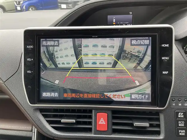 トヨタ エスクァイア ハイブリッド Gi プレミアムパッケージ 千葉県 2019(平31)年 4.8万km スパークリングブラックパールクリスタルシャイン 純正10インチナビ/(フルセグTV/BT/CD/DVD/FM/AM)/バックカメラ/衝突被害軽減システム/車線逸脱警報/クルーズコントロール/ハーフレザーシート/両側パワースライドドア/横滑り防止装置/ビルトインETC/アイドリングストップ/LEDヘッドライト/フォグランプ/オートライト/ウィンカーミラー/電動格納ミラー/純正15インチAW/シートヒーター/シートリフター/ステアリングヒーター/プッシュスタート/スマートキー/フロアマット/ドアバイザー/取扱説明書/保証書