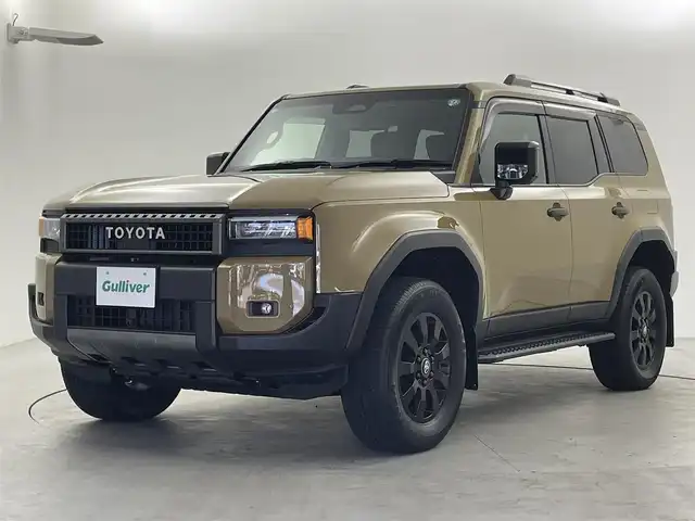 トヨタ ランドクルーザー ２５０ VX ファーストエディション 福井県 2024(令6)年 0.2万km ベージュＭ ４WD/サンルーフ/純正12.3インチディスプレイオーディオ/フルセグTV/TV/Bluetooth/Miracast/USB/AM/FM/トヨタチームメイト/トヨタセーフティセンス/・衝突軽減システム/・ブラインドスポットモニター/・安心降車アシスト/・レーダークルーズコントロール/・パノラミックビューモニター/・クリアランスソナー/・オートマチックハイビーム/ビルトインETC2.0/デジタルインナーミラー/ステアリングスイッチ/カラーメーター/マルチインフォメーションディスプレイ/電動パーキングブレーキ/ブレーキホールド/パワーシート/シートヒーター/シートベンチレーション/革巻きステアリング/ステアリングヒーター/ステアリングチルド機構/パワーバックドア