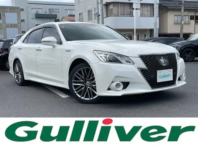 トヨタ クラウン ハイブリッド アスリートS 島根県 2013(平25)年 9.2万km ホワイトパールクリスタルシャイン 純正メーカーＯＰ８インチナビ　/(フルセグＴＶ/ＤＶＤ再生/Ｂｌｕｅｔｏｏｔｈ接続)/衝突軽減ブレーキ(オプション)/バックカメラ　/前方ドライブレコーダー　/ETC/クルーズコントロール　/アイドリングストップ　/パワーバックドア　/前後コーナーセンサー　/前席パワーシート　/前席シートヒーター/ハンドルヒーター/スマートキー　/純正HIDヘッドライト/純正１８インチアルミホイール/純正フロアマット/保証書・取扱説明書