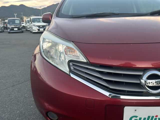 日産 ノート X 山梨県 2013(平25)年 8.4万km ラディアントレッド ポータブルナビ/ライトレベライザー/アイドリングストップ/スマートキー