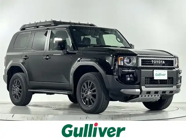 トヨタ ランドクルーザー ２５０ VX 佐賀県 2024(令6)年 0.8万km ブラック 純正12.3インチディスプレイオーディオ/ナビ機能付き/フルセグTV/Bluetooth/Applecarplay/Androidauto/ワンオーナー/メーカーオプション丸目LEDヘッドライト/サンルーフ/モデリスタプロテクターキット/モデリスタシグネチャーイルミブレード/全方位カメラ/デジタルインナールームミラー/衝突被害軽減システム/ブラインドスポットモニター/レーダークルーズコントロール/レーンアシスト/ロードサインアシスト/クリアランスソナー/オートライト/オートマチックハイビーム/LEDフォグライト/ビルトインETC2.0/電子パーキング/ブレーキホールド/ステアリングヒーター/純正ルーフラック/運転席・助手席シートヒーター/運転席・助手席エアシート/運転席パワーシート/レザーシート/パワーバックドア/純正18インチアルミホイール/純正フロアマット