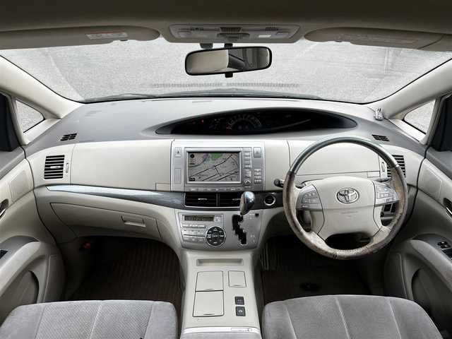 トヨタ エスティマ ハイブリッド G 道央・札幌 2006(平18)年 14.4万km ブラック ４WD/寒冷地仕様/純正HDDナビ/AM/FM/CD/DVD/ワンセグ/純正フリップダウンモニター/横滑り防止装置/クルーズコントロール/バックカメラ/サイドカメラ/フロントカメラ/SNOWMODE/EVMODE/両側パワースライドドア/D席パワーシート/革巻きステアリング/ワイパーデアイサー/AC100V/プッシュスタート/スマートキー/キセノンヘッドライト/オートライト/フォグランプ/電動格納ミラー/ウィンカーミラー/純正フロアマット/スペアキー/社外エンジンスターター