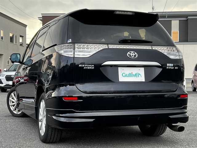 トヨタ エスティマ ハイブリッド G 道央・札幌 2006(平18)年 14.4万km ブラック ４WD/寒冷地仕様/純正HDDナビ/AM/FM/CD/DVD/ワンセグ/純正フリップダウンモニター/横滑り防止装置/クルーズコントロール/バックカメラ/サイドカメラ/フロントカメラ/SNOWMODE/EVMODE/両側パワースライドドア/D席パワーシート/革巻きステアリング/ワイパーデアイサー/AC100V/プッシュスタート/スマートキー/キセノンヘッドライト/オートライト/フォグランプ/電動格納ミラー/ウィンカーミラー/純正フロアマット/スペアキー/社外エンジンスターター