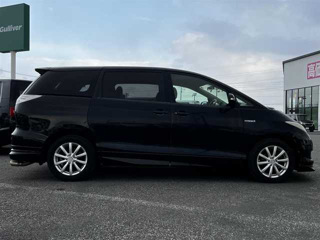 トヨタ エスティマ ハイブリッド G 道央・札幌 2006(平18)年 14.4万km ブラック ４WD/寒冷地仕様/純正HDDナビ/AM/FM/CD/DVD/ワンセグ/純正フリップダウンモニター/横滑り防止装置/クルーズコントロール/バックカメラ/サイドカメラ/フロントカメラ/SNOWMODE/EVMODE/両側パワースライドドア/D席パワーシート/革巻きステアリング/ワイパーデアイサー/AC100V/プッシュスタート/スマートキー/キセノンヘッドライト/オートライト/フォグランプ/電動格納ミラー/ウィンカーミラー/純正フロアマット/スペアキー/社外エンジンスターター