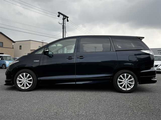 トヨタ エスティマ ハイブリッド G 道央・札幌 2006(平18)年 14.4万km ブラック ４WD/寒冷地仕様/純正HDDナビ/AM/FM/CD/DVD/ワンセグ/純正フリップダウンモニター/横滑り防止装置/クルーズコントロール/バックカメラ/サイドカメラ/フロントカメラ/SNOWMODE/EVMODE/両側パワースライドドア/D席パワーシート/革巻きステアリング/ワイパーデアイサー/AC100V/プッシュスタート/スマートキー/キセノンヘッドライト/オートライト/フォグランプ/電動格納ミラー/ウィンカーミラー/純正フロアマット/スペアキー/社外エンジンスターター