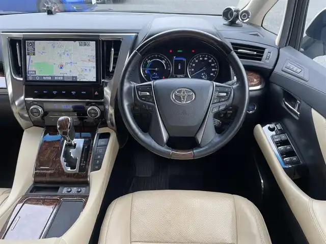 トヨタ アルファードハイブリット G Fパッケージ 埼玉県 2019(令1)年 15.1万km ラグジュアリーホワイトパールクリスタルシャインガラスフレーク /ワンオーナー//4WD//純10.5型メモリナビ//フルセグTV//バックカメラ//フリップダウンモニター//CD/DVD/Bluetooth//ベージュレザーシート//前2席パワーシート&エアシート//前2席&2列目シートヒーター//両側パワースライドドア//パワーバックドア//アダプティブクルーズコントロール//ビルトインETC2.0//スマートキーx2//LEDヘッドライト//デジタルインナーミラー//助手席&2列目オットマン//ステアリングヒーター//PCS 衝突軽減ブレーキ//LTA 車線逸脱抑制機能//ブラインドスポットモニター//パーキングサポートブレーキ//ロードサインアシスト//クリアランスソナー//W.サイド.カーテン.ニーエアバッグ//ABS/横滑り防止装置//コンビステアリング//オートライト/オートハイビーム//ドライブレコーダー(SDカード欠)//前後フォグランプ//プライバシーガラス//ドアバイザー//純正17インチAW//新車時保証書//取扱説明書//ナビ取説