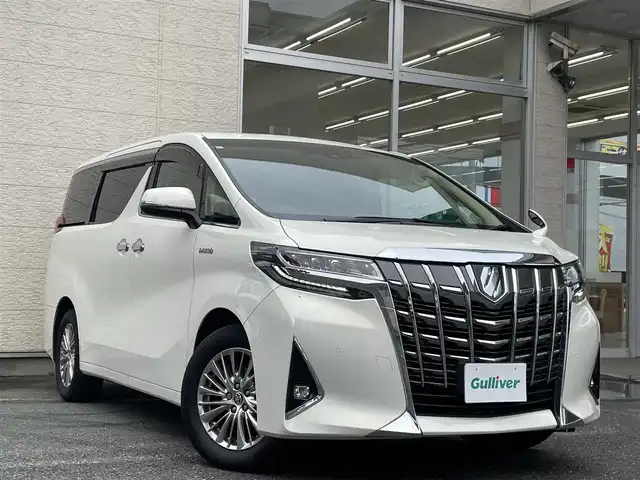 トヨタ アルファードハイブリット G Fパッケージ 埼玉県 2019(令1)年 15.1万km ラグジュアリーホワイトパールクリスタルシャインガラスフレーク /ワンオーナー//4WD//純10.5型メモリナビ//フルセグTV//バックカメラ//フリップダウンモニター//CD/DVD/Bluetooth//ベージュレザーシート//前2席パワーシート&エアシート//前2席&2列目シートヒーター//両側パワースライドドア//パワーバックドア//アダプティブクルーズコントロール//ビルトインETC2.0//スマートキーx2//LEDヘッドライト//デジタルインナーミラー//助手席&2列目オットマン//ステアリングヒーター//PCS 衝突軽減ブレーキ//LTA 車線逸脱抑制機能//ブラインドスポットモニター//パーキングサポートブレーキ//ロードサインアシスト//クリアランスソナー//W.サイド.カーテン.ニーエアバッグ//ABS/横滑り防止装置//コンビステアリング//オートライト/オートハイビーム//ドライブレコーダー(SDカード欠)//前後フォグランプ//プライバシーガラス//ドアバイザー//純正17インチAW//新車時保証書//取扱説明書//ナビ取説