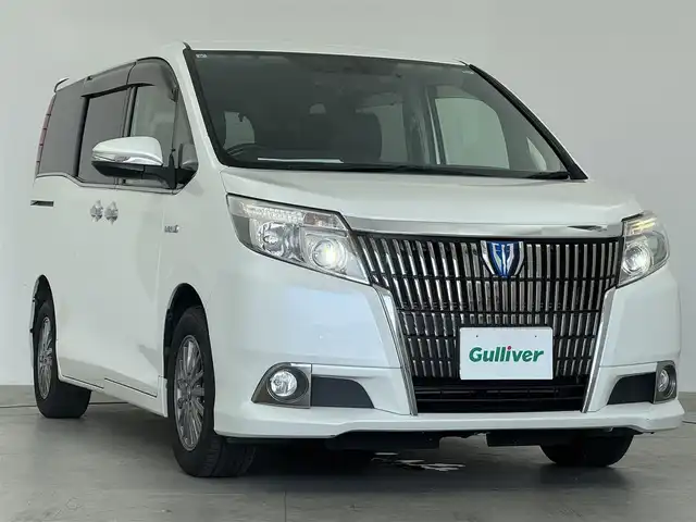 トヨタ エスクァイア ハイブリッド Gi 愛知県 2015(平27)年 10.1万km ホワイトパールクリスタルシャイン 11インチリアエンター　/クルーズコントロール　/両側パワースライドドア　/前席シートヒーター　/電動格納ミラー　/オートライト　/ドライブレコーダー　/ETC　/純正AW　