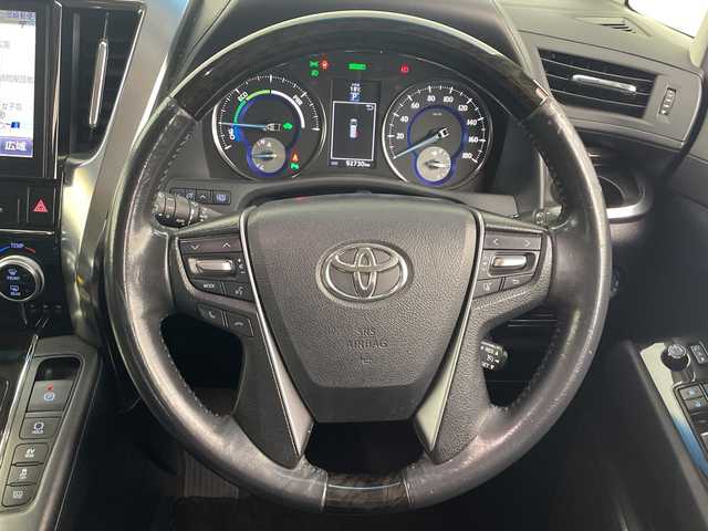 トヨタ アルファードハイブリット SR 愛知県 2015(平27)年 9.3万km ブラック 禁煙　純正１０型ナビ　純正フリップダウンモニター　クルーズコントロール　両側パワースライドドア　ハーフレザーシート　パワーシート　ビルトインＥＴＣ　バックカメラ　スマートキー　オートマチックハイ/純正10型ナビ/・Bluetooth/・CD/DVD/・フルセグテレビ/・SD音楽録音/純正フリップダウンモニター/バックカメラ/ハーフレザーシート/パワーシート/両側パワースライドドア/衝突軽減ブレーキ/レーンキープアシスト/オートマチックハイビーム/前後コーナーセンサー/クルーズコントロール/ビルトインETC/LEDヘッドライト