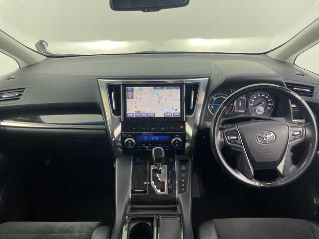 トヨタ アルファードハイブリット SR 愛知県 2015(平27)年 9.3万km ブラック 禁煙　純正１０型ナビ　純正フリップダウンモニター　クルーズコントロール　両側パワースライドドア　ハーフレザーシート　パワーシート　ビルトインＥＴＣ　バックカメラ　スマートキー　オートマチックハイ/純正10型ナビ/・Bluetooth/・CD/DVD/・フルセグテレビ/・SD音楽録音/純正フリップダウンモニター/バックカメラ/ハーフレザーシート/パワーシート/両側パワースライドドア/衝突軽減ブレーキ/レーンキープアシスト/オートマチックハイビーム/前後コーナーセンサー/クルーズコントロール/ビルトインETC/LEDヘッドライト