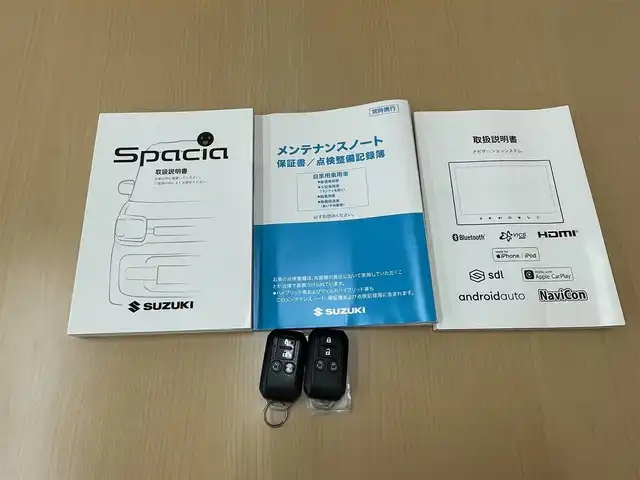 スズキ スペーシア カスタム HYBRID XS 愛知県 2021(令3)年 4.5万km ピュアホワイトP /禁煙車//メーカーナビ//AUDIO（AM・FM・DVD・CD・BlueTooth・ApplecarPiay）//フルセグテレビ//全方位カメラ・バックカメラ//クルーズコントール（追従機能有）//前方ドライブレコーダー（HDR１０３)//両側パワースライドドア//バックセンサー//ETC//LEDオートライト//車間距離制御システム//ヘッドアップディスプレイ//プリクラッシュ//レーンキープアシスト//シートヒーター（運転席）//オートリトラクトウィンカーミラー//コーナーセンサー//車線逸脱警報//リアサンシェード//運転切替スイッチ（Powerモー//スペアキー//ISOFIX//純正15インチAW//プリクラッシュ//トランクスポイラー//本革巻きステアリング//純正マット//純正ドアバイザー//横滑り防止//衝突安全ボディー//盗難防止システム//取扱説明書//記録簿//保証書//プライバシーガラス//UVカットガラス