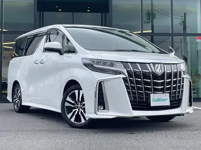 トヨタ アルファード S Cパッケージ 愛媛県 2021(令3)年 3.2万km ホワイトパールクリスタルシャイン 純正ディスプレイオーディオ（Bluetooth/フルセグTV）/CD/DVDデッキ/両側パワースライドドア/三眼LEDヘッドライト/純正12型フリップダウンモニター/レーダークルーズコントロール/黒レザーシート/シートヒーター/シートベンチレーション/ビルトインETC2.0/前後ドライブレコーダー/オットマン/ステアリングヒーター/シートメモリ/純正フロアマット/パワーバックドア/前後コーナーセンサー/パワーバックドア