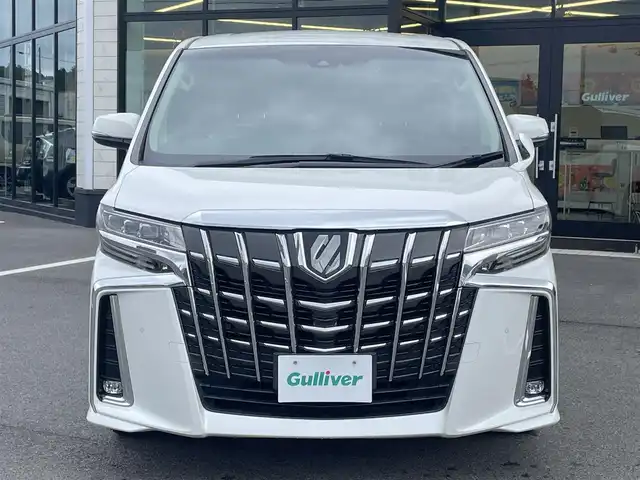 トヨタ アルファード S Cパッケージ 愛媛県 2021(令3)年 3.2万km ホワイトパールクリスタルシャイン 純正ディスプレイオーディオ（Bluetooth/フルセグTV）/CD/DVDデッキ/両側パワースライドドア/三眼LEDヘッドライト/純正12型フリップダウンモニター/レーダークルーズコントロール/黒レザーシート/シートヒーター/シートベンチレーション/ビルトインETC2.0/前後ドライブレコーダー/オットマン/ステアリングヒーター/シートメモリ/純正フロアマット/パワーバックドア/前後コーナーセンサー/パワーバックドア