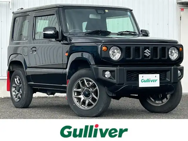 スズキ ジムニー XC 熊本県 2022(令4)年 1.6万km ブルーイッシュブラックパール3 ワンオーナー/純正オーディオ/・AM/FM/CD/AUX/横滑り防止機能/アイドリングストップ/レーンキープアシスト/ダウンヒルアシストコントロール/オートマチックハイビーム/クルーズコントロール/革巻きステアリング/・ステアリングリモコン/オートライト/・LEDライト/・フォグランプ/電動格納ミラー/・ウィンカーミラー/ドアバイザー/純正フロアマット/純正アルミホイール/スマートキー/・スペアキー