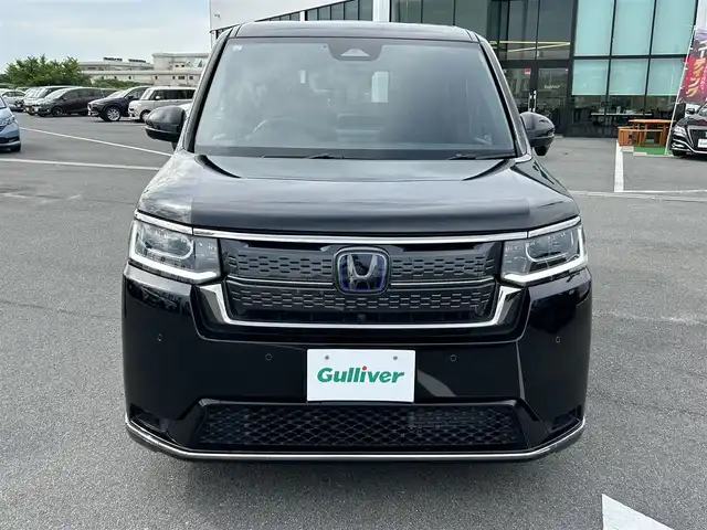 ホンダ ステップワゴン スパーダ eHEV 奈良県 2023(令5)年 1.8万km クリスタルブラックパール Gathers11.4インチナビ(フルセグTV/CD/DVD/AM・FM/BT/USB/HDMI)/ETC/Honda　SENSING/両側パワースライドドア/アラウンドビューモニター/パドルシフト/シートヒーター(D/N席)/2列目キャプテンシート/オットマン/パワーテールゲート/純正16インチアルミホイール(ベルリナブラック＋ダーク切削クリア)/LEDヘッドライト(シーケンシャルウインカー)/フォグランプ/LEDアクティブコーナリングライト/全席USBチャージャー(Type-C)/本革ステアリングホイール/純正フロアマット/スペアキー