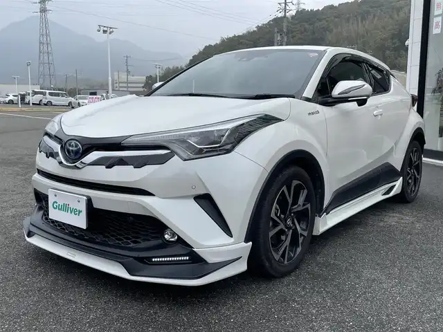 トヨタ Ｃ－ＨＲ G 兵庫県 2019(平31)年 9.8万km ホワイトパールクリスタルシャイン 禁煙車/純正９インチナビ/・Bluetooth・T-connect・SD/・CD/DVD・フルセグ・SD/プリクラッシュセーフティシステム/レーンキープアシスト/BSM/クリアランスソナー/レーダークルーズコントロール/オートライト/オートマチックハイビーム/TRDフルエアロ/電動パーキングブレーキ/ブレーキホールド/シートヒーターDN/ハーフレザーシート/LEDヘッドライト/前方ドラレコ/ビルドインETC/スマートキー/プッシュスタート