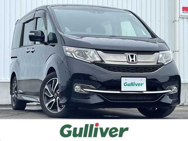 ホンダ ステップワゴン スパーダ クルスピセンシング 愛媛県 2017(平29)年 6.5万km プレミアムスパークルブラックパール 両側パワースライドドア/フリップダウンモニター/純正メモリナビ/CD/DVD/BT/MSV/iPod/フルセグTV/バックカメラ/ビルトインETC2.0/衝突被害軽減ブレーキ/レーンキープアシストシステム/アダプティブクルーズコントロール/ハーフレザーシート/D席＋N席シートヒーター/LEDヘッドライト/フォグライト/オートライト/純正フロアマット/後席サンシェード/純正16インチアルミホイール/スマートキー/プッシュスタート