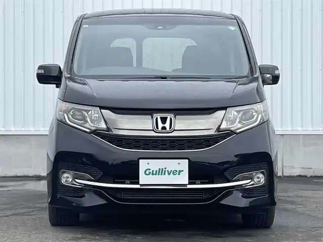 ホンダ ステップワゴン スパーダ クルスピセンシング 愛媛県 2017(平29)年 6.5万km プレミアムスパークルブラックパール 両側パワースライドドア/フリップダウンモニター/純正メモリナビ/CD/DVD/BT/MSV/iPod/フルセグTV/バックカメラ/ビルトインETC2.0/衝突被害軽減ブレーキ/レーンキープアシストシステム/アダプティブクルーズコントロール/ハーフレザーシート/D席＋N席シートヒーター/LEDヘッドライト/フォグライト/オートライト/純正フロアマット/後席サンシェード/純正16インチアルミホイール/スマートキー/プッシュスタート