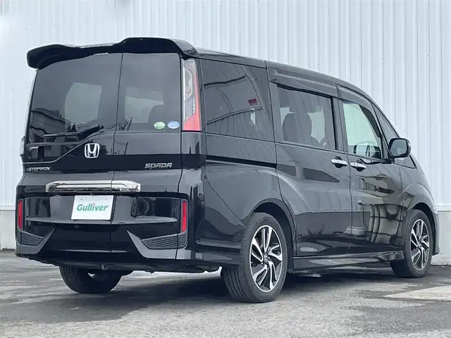 ホンダ ステップワゴン スパーダ クルスピセンシング 愛媛県 2017(平29)年 6.5万km プレミアムスパークルブラックパール 両側パワースライドドア/フリップダウンモニター/純正メモリナビ/CD/DVD/BT/MSV/iPod/フルセグTV/バックカメラ/ビルトインETC2.0/衝突被害軽減ブレーキ/レーンキープアシストシステム/アダプティブクルーズコントロール/ハーフレザーシート/D席＋N席シートヒーター/LEDヘッドライト/フォグライト/オートライト/純正フロアマット/後席サンシェード/純正16インチアルミホイール/スマートキー/プッシュスタート