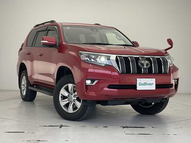 トヨタ ランドクルーザー プラド TX 沖縄県 2019(令1)年 2万km レッドマイカメタリック 純正ナビ　【NSCN-W68】/　(TV Bluetooth CD FM/AM)　/バックカメラ　/ＥＴＣ/前後ドライブレコーダー　/４ＷＤ　/ＬＥＤヘッドライト　/プッシュスタート　/スマートキー/スペアキー/トヨタセーフティセンス/・衝突被害軽減ブレーキ (プリクラッシュセーフティ)																									/・ハンドル操作サポート (レーントレーシングアシスト)																									/・追従ドライブ支援機能 (レーダークルーズコントロール)																									/・車線はみ出しアラート (レーンディパーチャーアラート)																									/・自動ハイビーム (オートマチックハイビーム)																									/純正１７インチアルミホイール　/純正フロアマット/クリアランスソナー