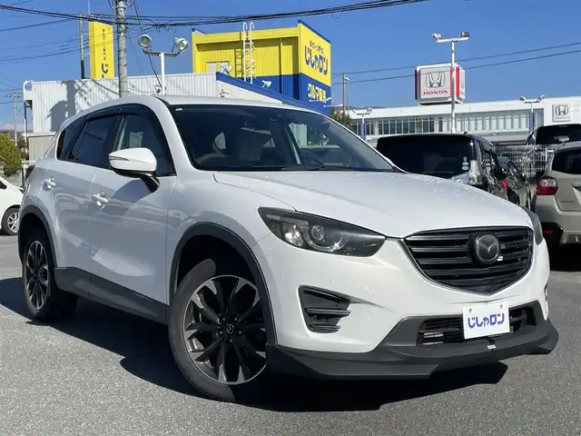 マツダ ＣＸ－５ XD Lパッケージ 山梨県 2015(平27)年 8.2万km クリスタルホワイトパールマイカ (株)IDOMが運営する【じしゃロン甲府店】の自社ローン専用車両になります。/こちらは現金またはオートローンご利用時の価格です。自社ローンご希望の方は別途その旨お申付け下さい/純正メモリーナビ/（フルセグTV/CD/DVD/BTオーディオ）/バックカメラ/ドライブレコーダー/レザーシート/前席パワーシート/前席シートヒーター/社外フロントエアロ/HIDヘッドライト/フォグランプ/オートライト/衝突被害軽減ブレーキ/横滑り防止装置/アイドリングストップ/新車時保証書/取扱説明書/ナビ取扱説明書
