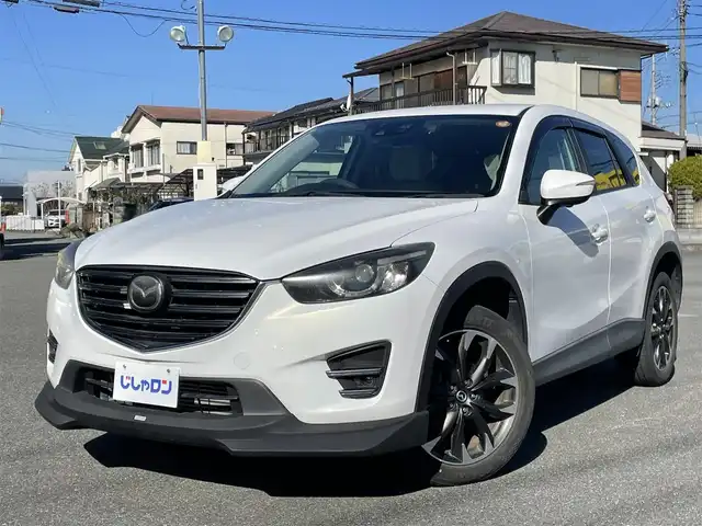 マツダ ＣＸ－５ XD Lパッケージ 山梨県 2015(平27)年 8.2万km クリスタルホワイトパールマイカ (株)IDOMが運営する【じしゃロン甲府店】の自社ローン専用車両になります。/こちらは現金またはオートローンご利用時の価格です。自社ローンご希望の方は別途その旨お申付け下さい/純正メモリーナビ/（フルセグTV/CD/DVD/BTオーディオ）/バックカメラ/ドライブレコーダー/レザーシート/前席パワーシート/前席シートヒーター/社外フロントエアロ/HIDヘッドライト/フォグランプ/オートライト/衝突被害軽減ブレーキ/横滑り防止装置/アイドリングストップ/新車時保証書/取扱説明書/ナビ取扱説明書