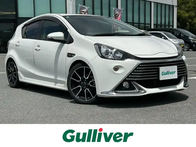 トヨタ アクア G G’s 奈良県 2014(平26)年 7.3万km ライムホワイトパールクリスタルシャイン 純正ナビ　/フルセグＴＶ　/バックカメラ　/シートヒーター　/ハーフレザーシート　/ＥＴＣ　/スマートキー　/純正１７インチアルミホイール　/プッシュスタート　/ＡＡＣ　/ステアリングスイッチ　/Ｂｌｕｅｔｏｏｔｈ/CD/DVD/SD