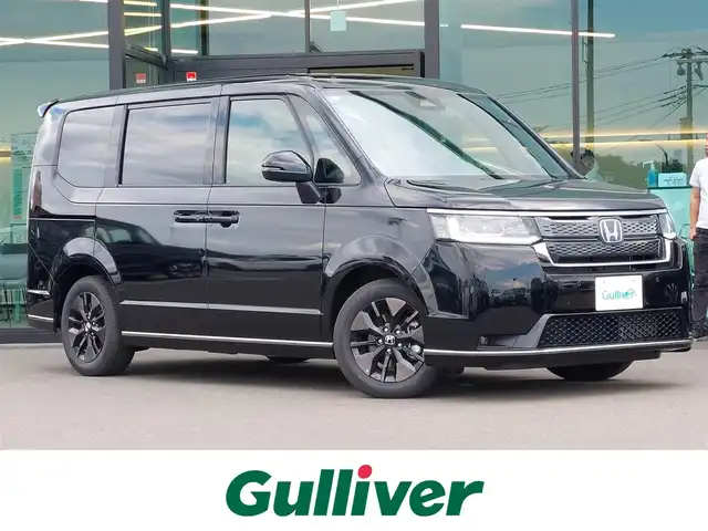 ホンダ ステップワゴン スパーダ eHEV 東京都 2024(令6)年 0.2万km クリスタルブラックパール 純正ナビ/バックカメラ/ETC/両側パワースライドドア/パワーバックドア/ハーフレザーシート/オットマン/シートヒーター/衝突軽減システム/レーンキープアシスト/ブラインドスポットモニター/コーナーセンサー/レーダークルーズコントロール/パドルシフト