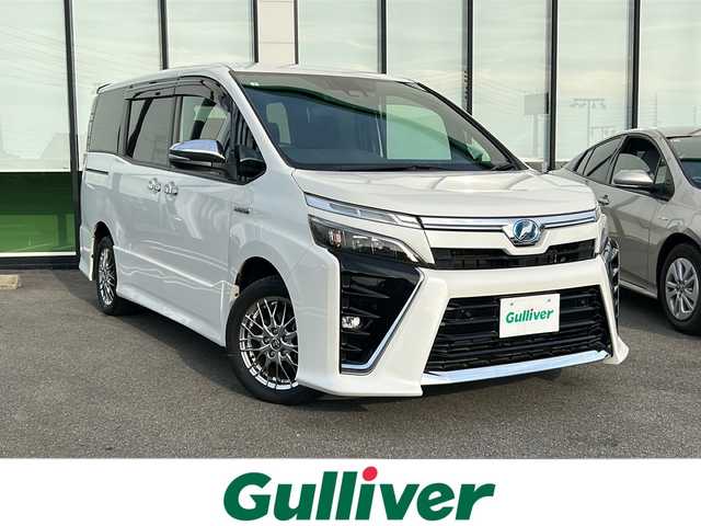 トヨタ ヴォクシー ハイブリッド ZS 煌Ⅱ 岐阜県 2019(平31)年 2.8万km ホワイトパールクリスタルシャイン 登録時走行距離27/258km/純正１０型SDナビ　/ドライブレコーダー　/ビルトインＥＴＣ　/バックカメラ　/クルーズコントロール　/両側パワースライド　/衝突軽減システム　/横滑り防止装置　/レーンキープアシスト　/前後コーナーセンサー　/ＬＥＤヘッドライト/オートライト/プッシュスタート/スマートキー/純正16インチアルミホイール/フロアマット
