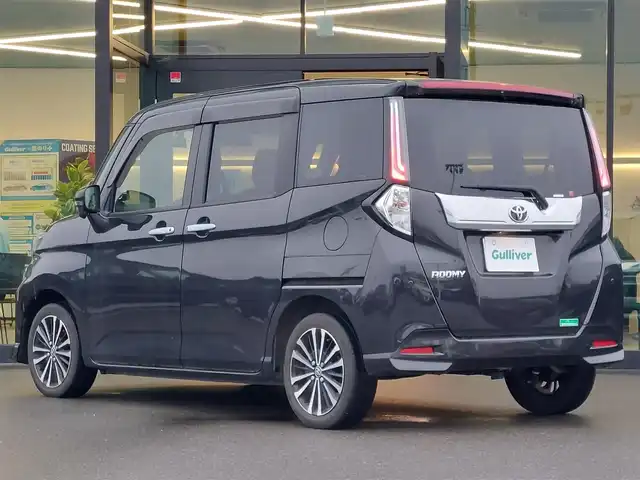 トヨタ ルーミー カスタムG－T 東京都 2021(令3)年 2.7万km ブラックマイカメタリック 純正9インチナビ/フルセグ/バックカメラ/フリップダウンモニター/両側パワースライドドア/ビルトインETC2.0/シートヒーター/スマートアシスト/・衝突回避支援ブレーキ機能/・車線逸脱警報機能/・路側逸脱警報/・ブレーキ抑制付誤発進制御機能/・アダプティブハイビーム/・コーナーセンサー/・アダプティブクルーズコントロール