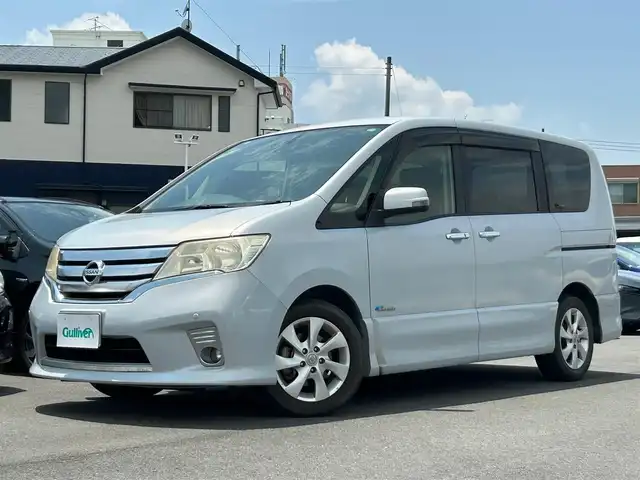 日産 セレナ ハイウェイスター Sハイブリッド 静岡県 2012(平24)年 13.9万km エターナルスノーホワイト 純正ＳＤナビ（Ｂｌｕｅｔｏｏｔｈ，ＣＤ，ＤＶＤ，フルセグＴＶ）/フリップダウンモニター/バックカメラ/前後コーナーセンサー/ＨＩＤヘッドライト/クルーズコントロール/スマートキー/純正アルミホイール/プッシュスタート/パワーステアリング/パワーウインドウ/パーキングアシスト/スペアキー/３列シート/純正フロアマット/片側パワースライドドア/ABS/横滑り防止装置/盗難防止装置/オートライト/ダブルエアバッグ