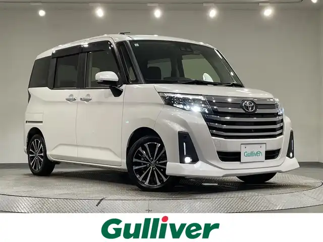 トヨタ ルーミー カスタムG－T 愛知県 2021(令3)年 2万km パールホワイトⅢ 純正９インチディスプレイオーディオ/パノラミックビューモニター/両側パワースライドドア/スマートアシストIII/衝突軽減ブレーキ/レーダークルーズコントロール/クリアランスソナー/車線逸脱警報/電動パーキングブレーキ/ブレーキホールド/シートヒーター/前後ドライブレコーダー/ビルトインＥＴＣ/USB入力端子/アクセサリーソケット/アイドリングストップ/純正15インチアルミホイール