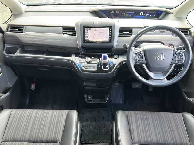 ホンダ フリード ハイブリット EX 広島県 2019(平31)年 4.5万km プレミアムスパークルブラックパール 禁煙車/ワンオーナー/ホンダセンシング/・衝突軽減ブレーキ〈CMBS〉/・誤発進抑制機能/・ACC〈アダプティブ・クルーズ・コントロール〉/・LKAS〈車線維持支援システム〉/・行者事故低減ステアリング/・路外逸脱抑制機能/・先行車発進お知らせ機能/・標識認識機能/Cパッケージ/Sパッケージ/・本革巻ステアリングホイール/・コンビシート&専用インテリア/・15インチアルミホイール/・シートバックアッパーポケット/コンフォートビューパッケージ/純正ナビ(VXM-194VFi)/・フルセグTV/CD/DVD/Bluetooth/SD/バックカメラ/両側パワースライドドア/ステアリングスイッチ/オートライト/LEDヘッドライト＋アクティブコーナリングライト/ハーフレザー/シートヒーター/スマートキー/プッシュスタート/スペアキー/前、後ドライブレコーダー/ETC/純正ドアバイザー/W+サイド+カーテンエアバック