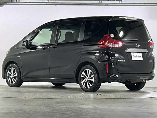 ホンダ フリード ハイブリット EX 広島県 2019(平31)年 4.5万km プレミアムスパークルブラックパール 禁煙車/ワンオーナー/ホンダセンシング/・衝突軽減ブレーキ〈CMBS〉/・誤発進抑制機能/・ACC〈アダプティブ・クルーズ・コントロール〉/・LKAS〈車線維持支援システム〉/・行者事故低減ステアリング/・路外逸脱抑制機能/・先行車発進お知らせ機能/・標識認識機能/Cパッケージ/Sパッケージ/・本革巻ステアリングホイール/・コンビシート&専用インテリア/・15インチアルミホイール/・シートバックアッパーポケット/コンフォートビューパッケージ/純正ナビ(VXM-194VFi)/・フルセグTV/CD/DVD/Bluetooth/SD/バックカメラ/両側パワースライドドア/ステアリングスイッチ/オートライト/LEDヘッドライト＋アクティブコーナリングライト/ハーフレザー/シートヒーター/スマートキー/プッシュスタート/スペアキー/前、後ドライブレコーダー/ETC/純正ドアバイザー/W+サイド+カーテンエアバック