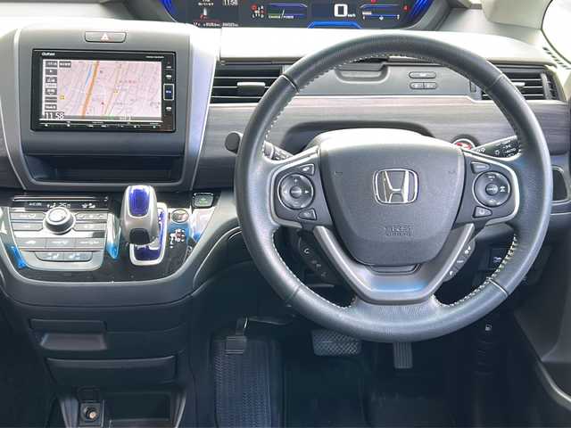 ホンダ フリード ハイブリット EX 広島県 2019(平31)年 4.5万km プレミアムスパークルブラックパール 禁煙車/ワンオーナー/ホンダセンシング/・衝突軽減ブレーキ〈CMBS〉/・誤発進抑制機能/・ACC〈アダプティブ・クルーズ・コントロール〉/・LKAS〈車線維持支援システム〉/・行者事故低減ステアリング/・路外逸脱抑制機能/・先行車発進お知らせ機能/・標識認識機能/Cパッケージ/Sパッケージ/・本革巻ステアリングホイール/・コンビシート&専用インテリア/・15インチアルミホイール/・シートバックアッパーポケット/コンフォートビューパッケージ/純正ナビ(VXM-194VFi)/・フルセグTV/CD/DVD/Bluetooth/SD/バックカメラ/両側パワースライドドア/ステアリングスイッチ/オートライト/LEDヘッドライト＋アクティブコーナリングライト/ハーフレザー/シートヒーター/スマートキー/プッシュスタート/スペアキー/前、後ドライブレコーダー/ETC/純正ドアバイザー/W+サイド+カーテンエアバック