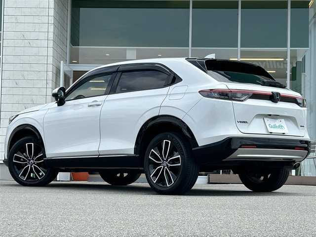 ホンダ ヴェゼル ハイブリッド e:HEV Z 兵庫県 2021(令3)年 1.8万km プラチナホワイトパール 9インチ純正ナビ/BT/フルセグ/CD／DVD/前後ドラレコ/ETC/バックカメラ/追従クルーズコントロール/パドルシフト/革巻ステアリング/パワーバックドア/前席シートヒーター/ステアリングヒーター/ワイヤレス充電器/USB端子/ステアリングスイッチ/ハーフレザーシート