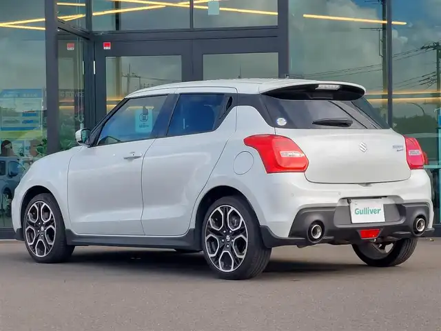 スズキ スイフト スポーツ 東京都 2023(令5)年 2.3万km ピュアホワイトP 社外ナビ/ワンセグ/バックカメラ/ETC/ドライブレコーダー/シートヒーター/衝突軽減ブレーキ/レーンキープアシスト/ブラインドスポットモニター/コーナーセンサー/レーダークルーズコントロール/スマートキー/純正17インチAW