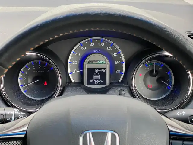ホンダ フィット シャトル ハイブリッド スマートセレ 岐阜県 2011(平23)年 15.8万km アラバスターシルバーメタリック ワンオーナー/ドアバイザー　/フロアマット　/社外ルームミラー　/ハーフレザー　/Ｓｔｒａｄａメモリナビ　/ＪＯＫＥＲ製１５インチアルミホイール　/ハロゲンヘッドライト　/クルーズコントロール　/ＥＴＣ
