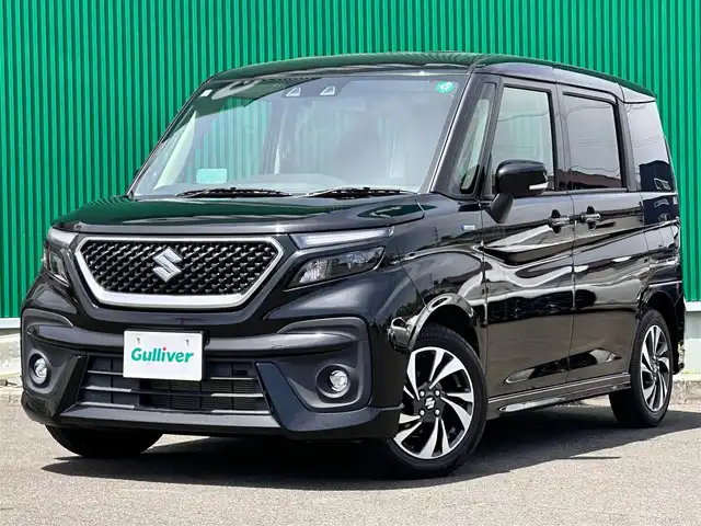 スズキ ソリオ バンディット HV MV 宮城県 2021(令3)年 3万km スーパーブラックパール パワースライドドア（運転席側）/＝＝＝/セーフティサポート/・デュアルカメラブレーキサポート/・車線逸脱警報機能/・誤発進抑制機能/・ふらつき警報機能/・先行車発進お知らせ機能/・ハイビームアシスト/・全車速追従機能付アダプティブクルーズコントロール/・標識認識機能/・後退時ブレーキサポート/・後方誤発進抑制機能/・リアパーキングセンサー/ヘッドアップディスプレイ/純正8型SDナビゲーション【CN-RZ865】/AM FM フルセグ Bluetooth CD DVD SD/バックカメラ/ビルトインETC/前席シートヒーター/両側パワースライドドア/革巻きステアリング/ステアリングスイッチ/LEDヘッドライト/オートライト/スマートキー/プッシュスタート/スペアキー1本/アイドリングストップ/横滑り防止機能/純正15インチAW/純正フロアマット/W/サイド/カーテンエアバッグ
