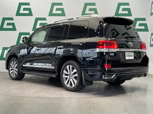 トヨタ ランドクルーザー ZX 鹿児島県 2021(令3)年 1.8万km アティチュードブラックマイカ モデリスタエアロ/純正T-Connect SDナビゲーション/フルセグTV/BT/CD/DVD/MSV/AM/FM/マルチテレインモニター/プレミアムサウンドシステム/リヤシートエンターテイメントシステム/サンルーフ/プレミアムナッパ本革シート/シートベンチレーション&シートヒーター/シートメモリ/レーダークルーズコントロール/パワーバックドア/純正20インチアルミホイール/純正LEDヘッドライト/純正フロアマット/純正ドアバイザー