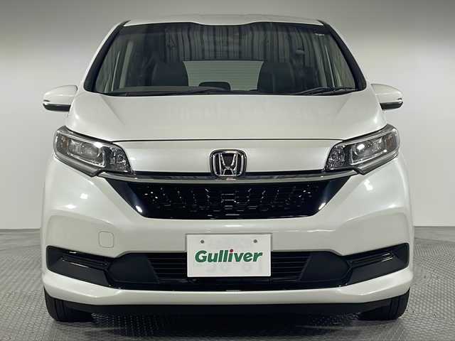 ホンダ フリード ハイブリット G ホンダセンシング 神奈川県 2021(令3)年 3.1万km プラチナホワイトパール 純正9インチナビ/CD&DVD&BT&SD&USB&HDIM&フルセグTV/バックカメラ/ビルトインETC/両側パワースライドドア/ハーフレザーシート/シートヒーター前席/ホンダセンシング/衝突軽減ブレーキ/誤発進抑制機能/後方後発進抑制機能/歩行者事故低減ステアリング/アダプティブクルーズコントロール/車線維持支援システム/路外逸脱抑制機能/先行車発進お知らせ機能/標識認識機能