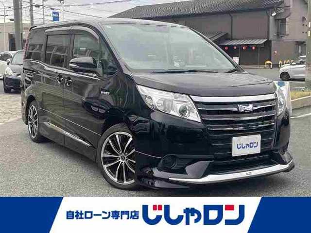トヨタ ノア ハイブリッド X ディライトプラス 愛知県 2015(平27)年 14.7万km ブラック (株)IDOMが運営する【じしゃロン名古屋鳴海店】の自社ローン専用車両になりますこちらは現金またはオートローンご利用時の価格です。自社ローンご希望の方は別途その旨お申付け下さい/ワンオーナー/禁煙車/純正フロアマット/純正ドアバイザー/社外18インチAW（AMD）/両側パワースライドドア/モデリスタエアロ/社外前方ドラレコ/HIDヘッドライト/オートライト/USB端子/リアサイドサンシェード/Clazzioレザー調シートカバー/純正AW付（15インチ）スタッドレスタイヤ積込/W＋サイドエアバッグ/保証書/取説/スペアキー