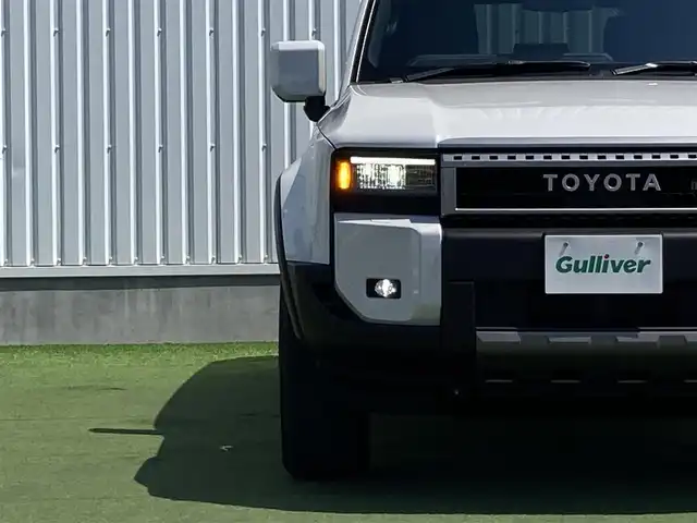 トヨタ ランドクルーザー ２５０ VX 香川県 2024(令6)年 0.1万km プラチナホワイトパールマイカ トヨタセーフティーセンス/・プリクラッシュ/・LTA/トヨタチームメイトADドライブ（OP）/緊急操舵支援/フロントクロストラフィックアラート/レーンチェンジアシスト/純正12.3インチDA/床下透過パノラミックビュー/プレミアムサウンド10スピーカー/電動ムーンルーフ/レザーシート/シートヒーター/ベンチレーション/パワーシート/革巻きステアリング/ステアリングヒーター/ステアリングリモコン/レーダークルーズ/LEDライト/パワーバックドア/デジタルインナーミラー/スマートキー/プッシュスタート